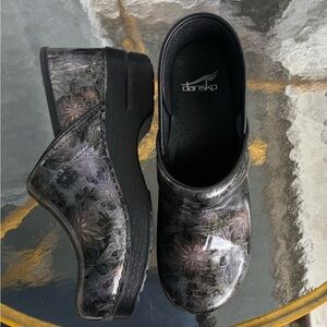 Dansko Women's Black and Silver Floral Clogs